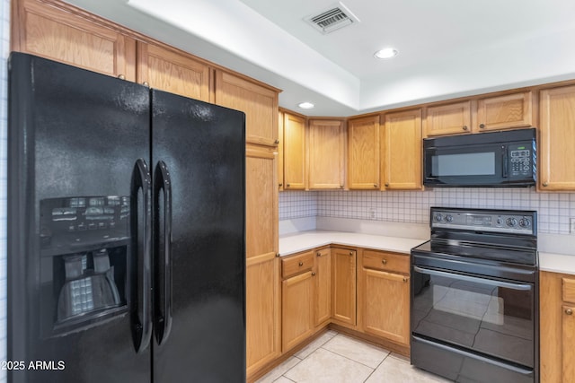 8666 E Cheryl Dr, Scottsdale, AZ 85258 - kitchen with visible vents, light countertops, light tile patterned floors, backsplash, and black appliances