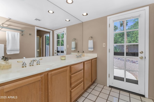 8666 E Cheryl Dr, Scottsdale, AZ 85258 - full bathroom with visible vents, a sink, double vanity, and a wealth of natural light