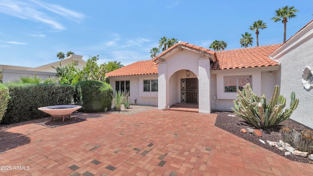 8666 E Cheryl Dr, Scottsdale, AZ 85258 - exterior space featuring a tile roof, a patio area, and stucco siding