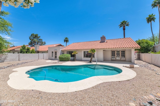 8666 E Cheryl Dr, Scottsdale, AZ 85258 - view of pool featuring a fenced in pool, a fenced backyard, a patio area, and french doors