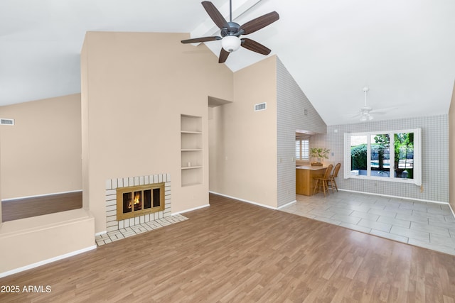 8666 E Cheryl Dr, Scottsdale, AZ 85258 - unfurnished living room with a ceiling fan, visible vents, wood finished floors, high vaulted ceiling, and baseboards