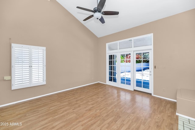 8666 E Cheryl Dr, Scottsdale, AZ 85258 - unfurnished room featuring high vaulted ceiling, baseboards, a ceiling fan, and light wood-style flooring