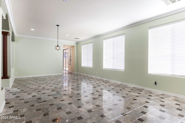 empty room with an inviting chandelier and ornamental molding