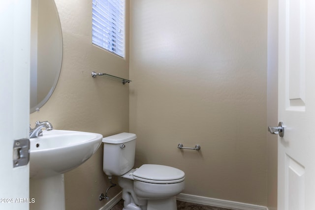 bathroom with toilet and sink