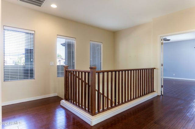 hallway with dark wood-type flooring