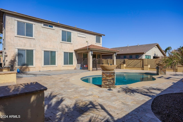 view of swimming pool featuring a patio area