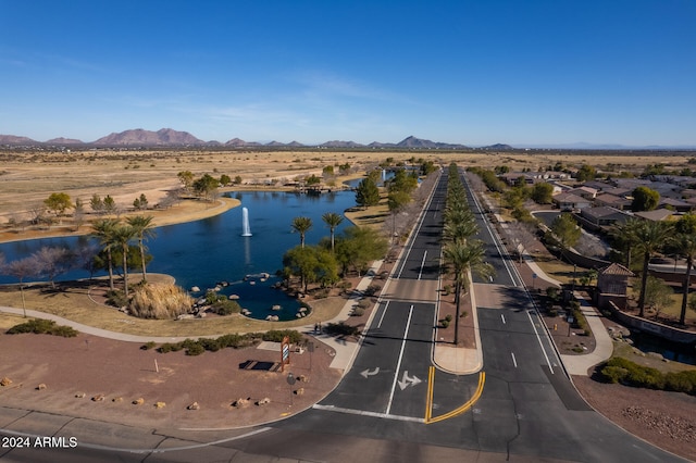 aerial view featuring a water and mountain view