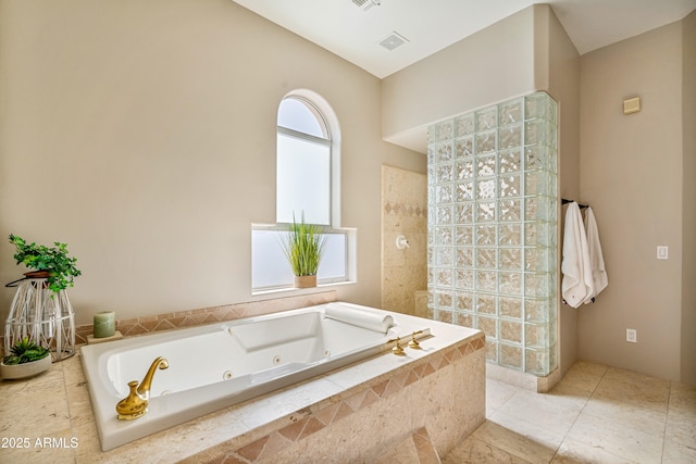 full bath featuring a whirlpool tub, tile patterned flooring, walk in shower, and visible vents