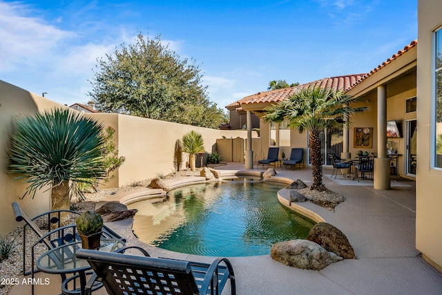 view of pool with a fenced backyard, outdoor dining area, a fenced in pool, and a patio