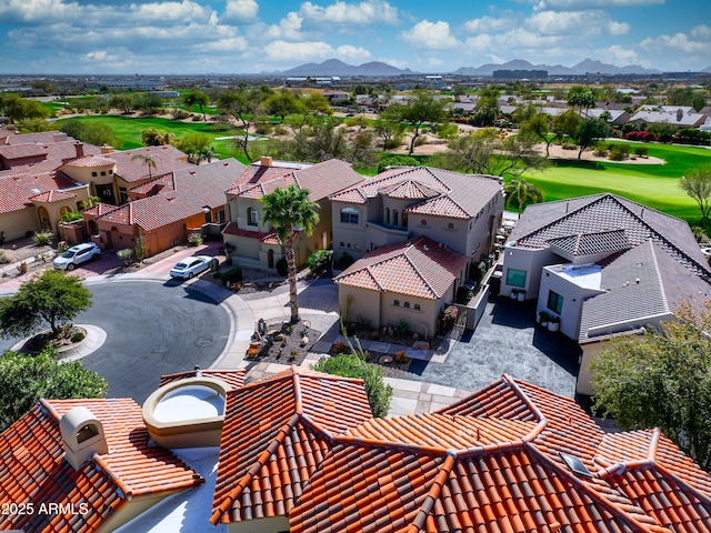 birds eye view of property featuring a mountain view, golf course view, and a residential view