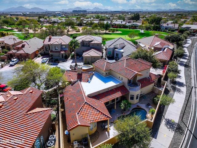 birds eye view of property with a mountain view and a residential view