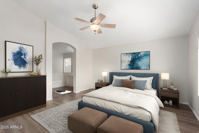 bedroom with dark hardwood / wood-style floors and ceiling fan