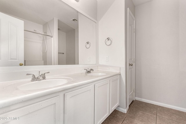 bathroom featuring tile patterned flooring and vanity