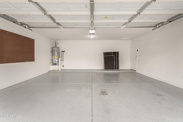 garage featuring gas water heater and a garage door opener