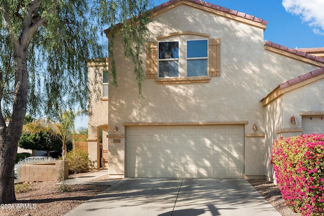 mediterranean / spanish-style house featuring a garage