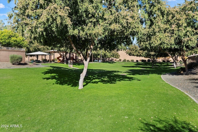 view of community featuring a gazebo and a lawn