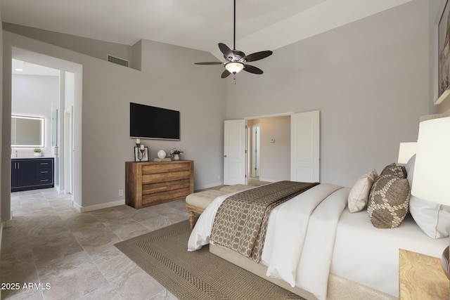 bedroom featuring visible vents, a towering ceiling, baseboards, and a ceiling fan
