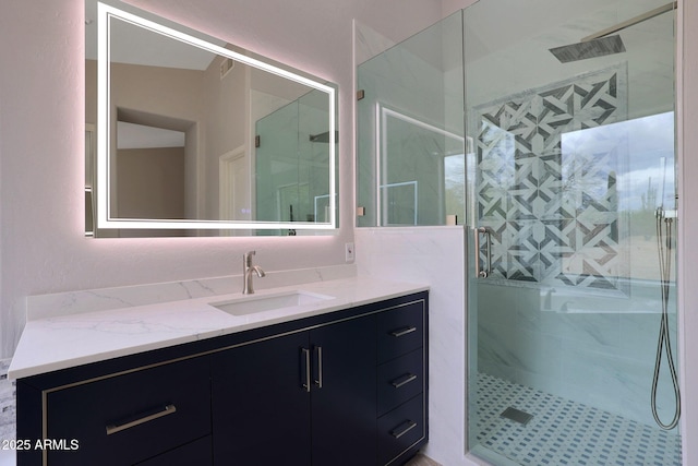 full bath featuring vanity and a stall shower