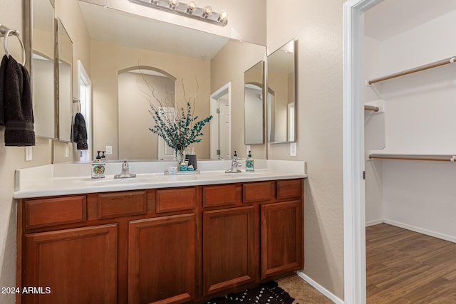 bathroom with vanity and hardwood / wood-style floors