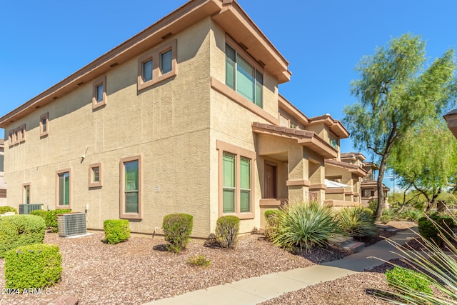 view of home's exterior with central AC