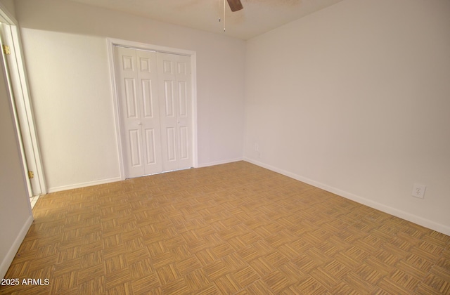 unfurnished bedroom with ceiling fan, baseboards, and a closet