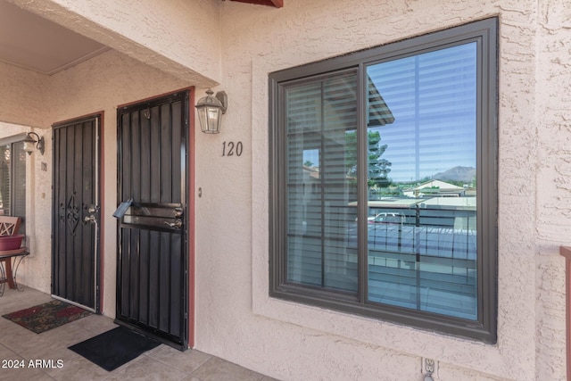 455 S Delaware Dr Unit 120, Apache Junction, AZ 85120 - view of exterior entry featuring stucco siding