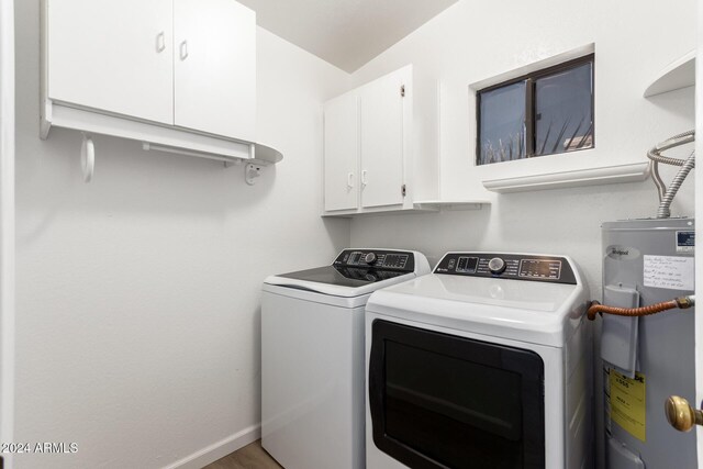455 S Delaware Dr Unit 120, Apache Junction, AZ 85120 - laundry area featuring electric water heater, washer and clothes dryer, cabinet space, and baseboards