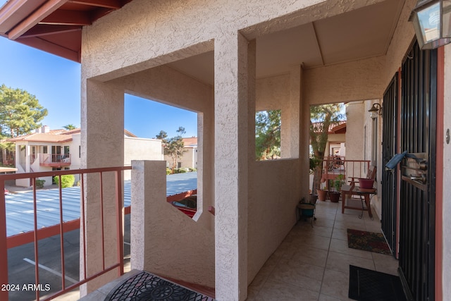 view of patio featuring a balcony