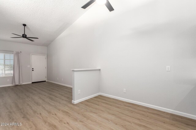 455 S Delaware Dr Unit 120, Apache Junction, AZ 85120 - unfurnished living room featuring a ceiling fan, wood finished floors, baseboards, and a textured ceiling