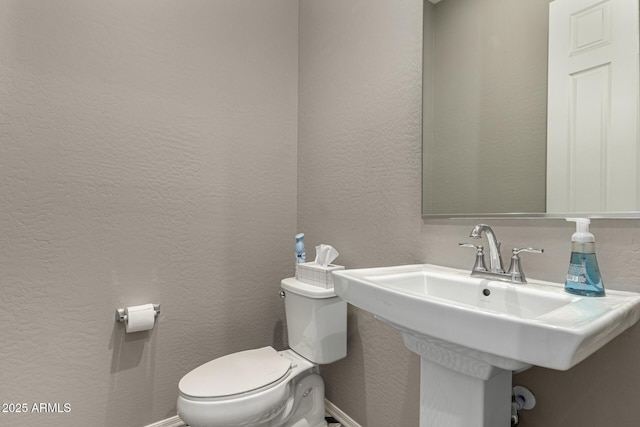 bathroom with sink and toilet