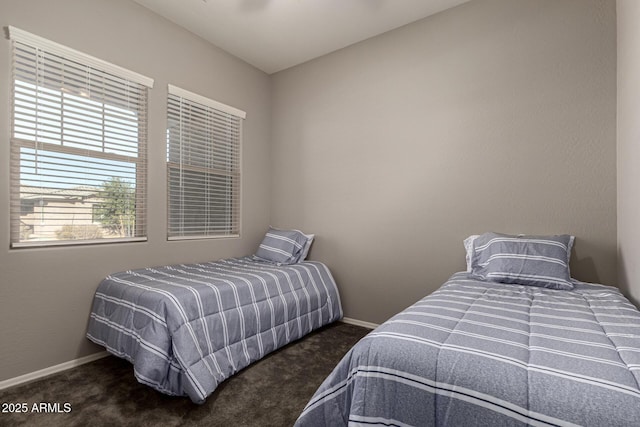 bedroom with lofted ceiling and dark carpet