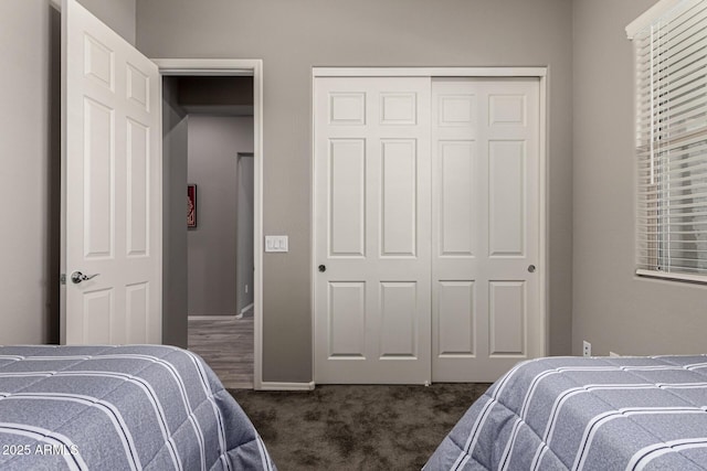 carpeted bedroom featuring a closet