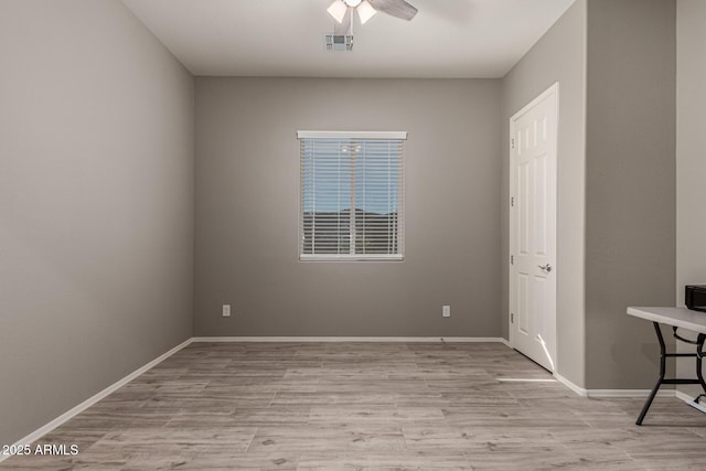 unfurnished room with ceiling fan and light hardwood / wood-style floors