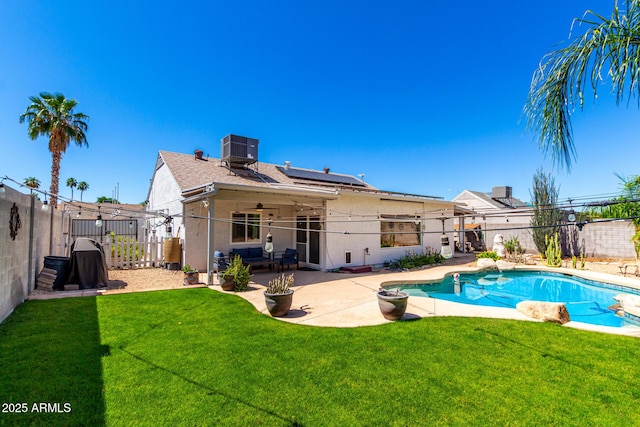 view of pool with cooling unit, a patio, and a ceiling fan