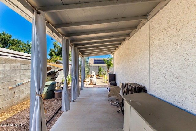 view of patio featuring fence