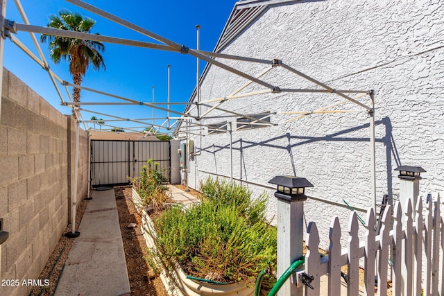 view of side of home with fence