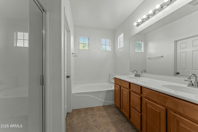 bathroom with vanity and shower with separate bathtub