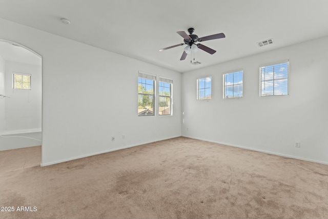 carpeted empty room with ceiling fan