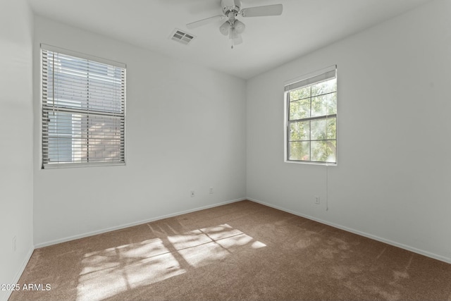 carpeted empty room with ceiling fan