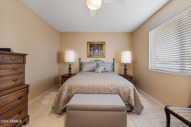 tiled bedroom with ceiling fan