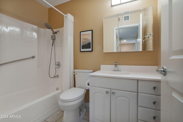 full bathroom featuring tile patterned floors, vanity, shower / bath combination with curtain, and toilet