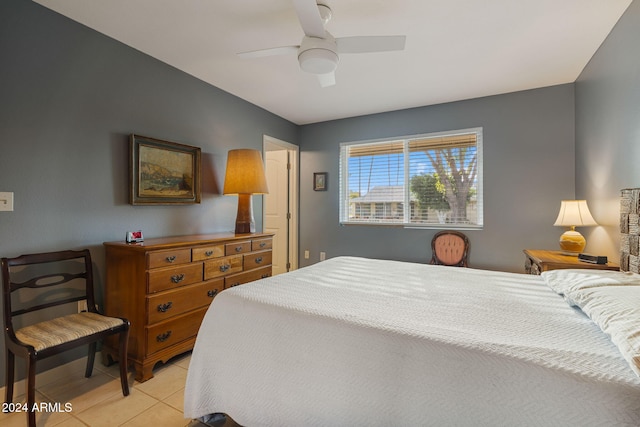 tiled bedroom with ceiling fan