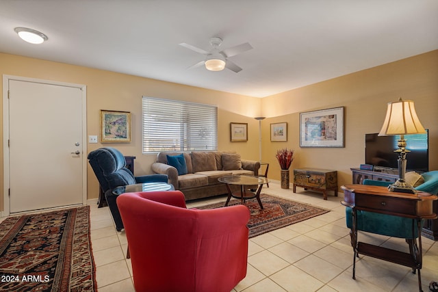 living room with ceiling fan and light tile patterned flooring