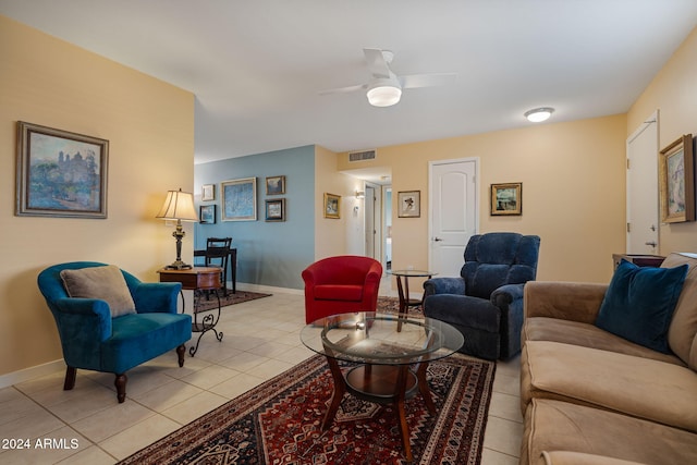 tiled living room with ceiling fan