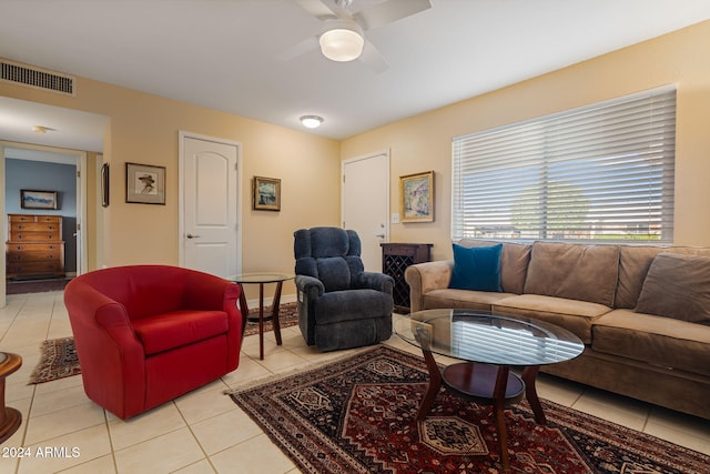 living room featuring light tile patterned floors and ceiling fan