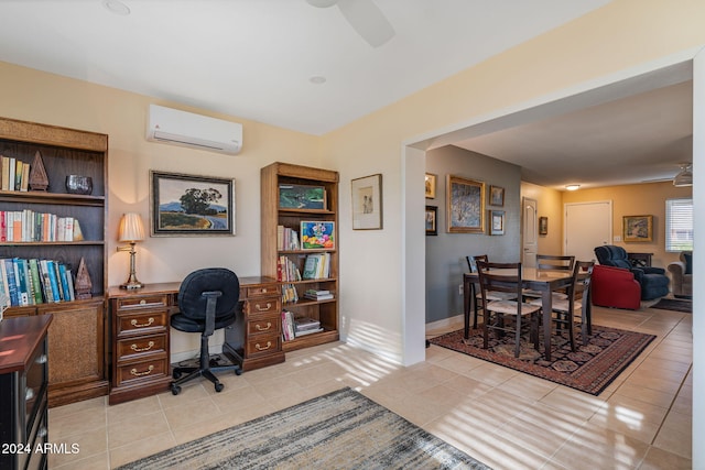 office with ceiling fan, an AC wall unit, and light tile patterned floors