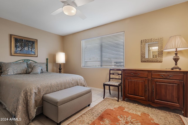 tiled bedroom with ceiling fan