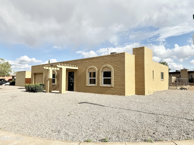 view of front of property featuring an attached garage and driveway