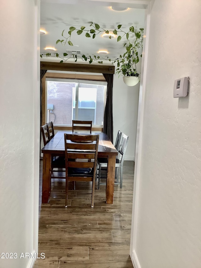 dining room with hardwood / wood-style floors