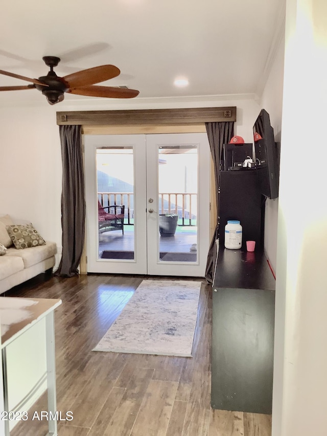 doorway with french doors, hardwood / wood-style flooring, ornamental molding, and ceiling fan